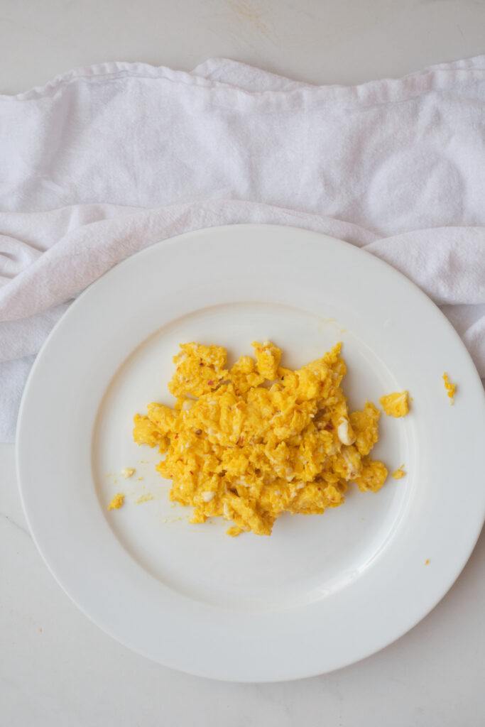 Scrambled eggs on a white plate