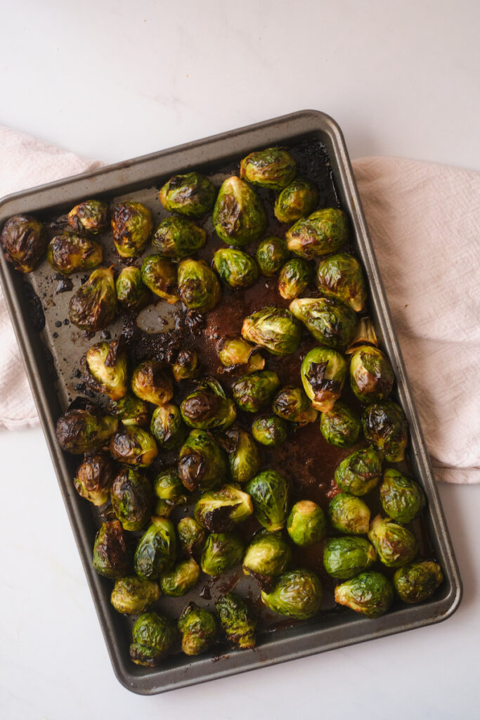 brussel sprouts on a baking sheet after roasting