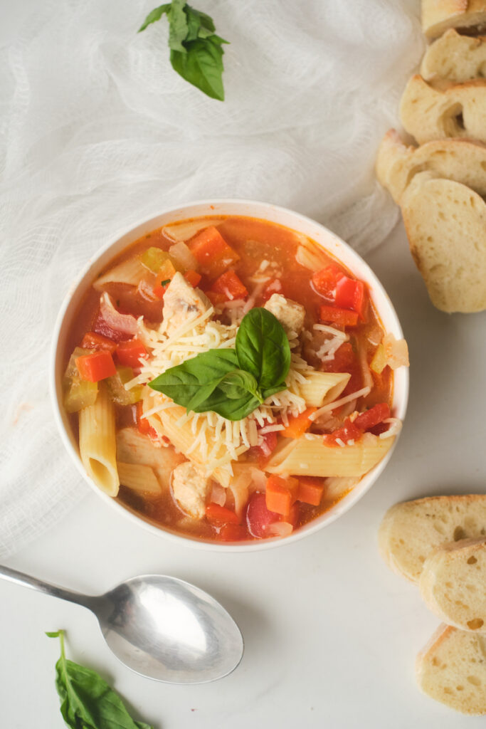 chicken basil and pasta soup with bread and cheese. Basil and tomatoes go well together and are a classic basil flavor pairing