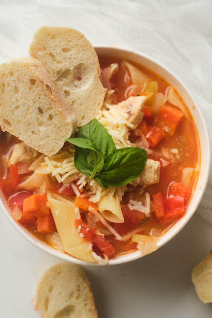 chicken basil and pasta soup with bread and cheese