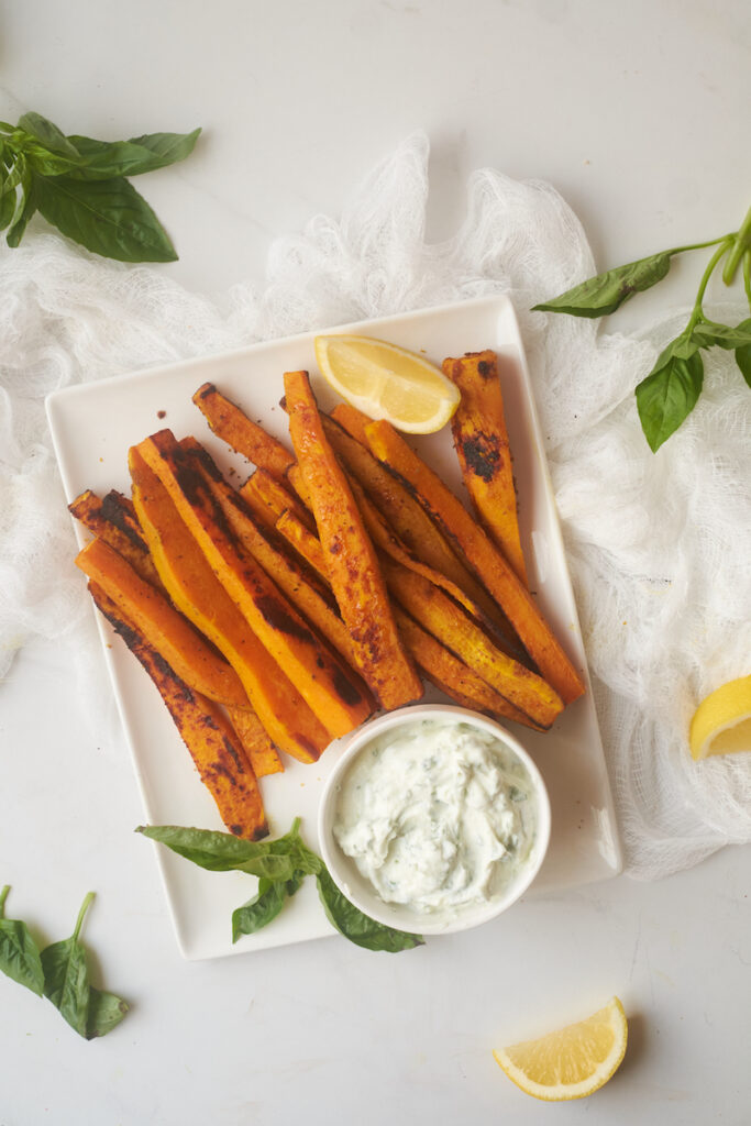 curry yam fries with basil mint yoghurt dip on a serving dish