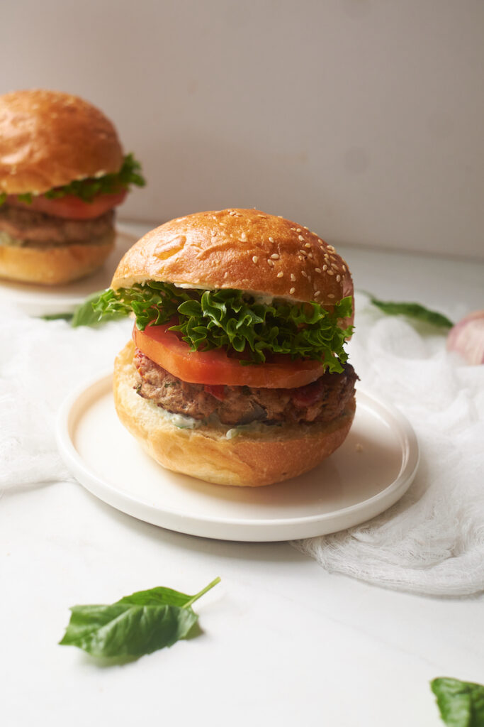 a homemade portobello mushroom turkey burger with basil aioli on a plate