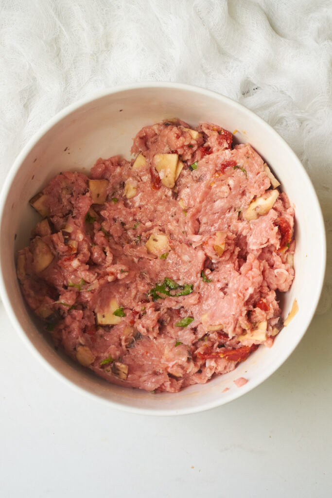 ground turkey mixed with sundried tomatoes and other ingredients to make turkey burger patties