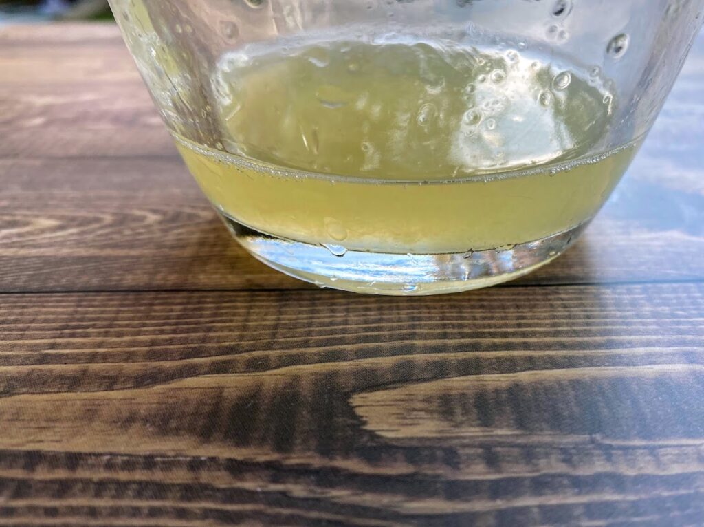 Lemon juice that's been freshly squeezed in a glass jar