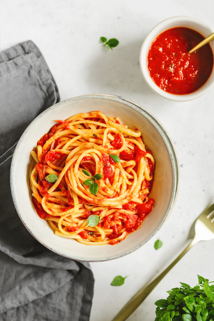 Greek basil leaves tossed on top of spaghetti